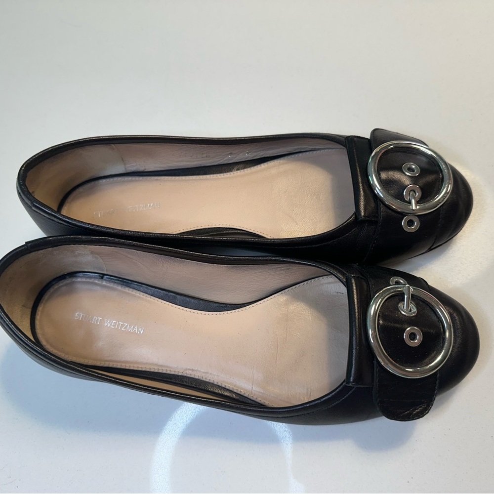 Stuart Weitzman size 7 black leather flats with silver buckle and heel accent